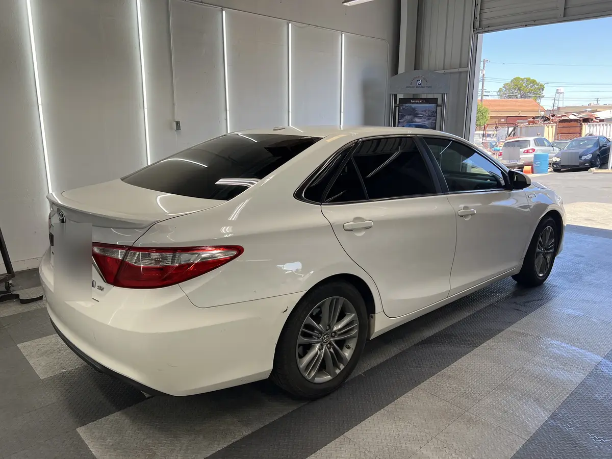 White Toyota Camry after Avery Dennison Encore carbon window tint (view 3)