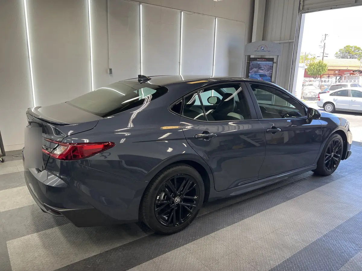 Gray Toyota Camry before window tinting, factory glass (view 3)