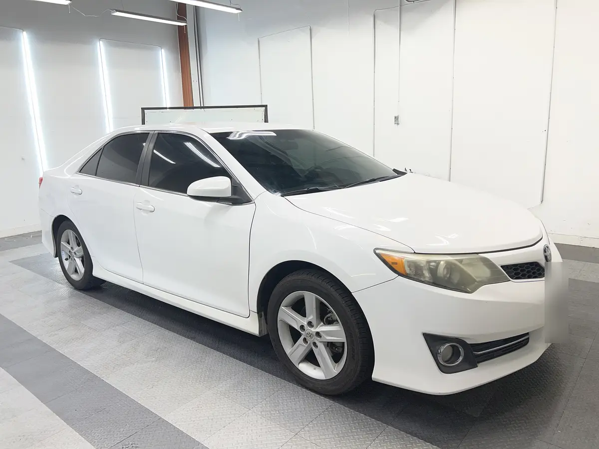 White Toyota Camry after Avery Dennison Encore Supreme ceramic window tint (view 1)