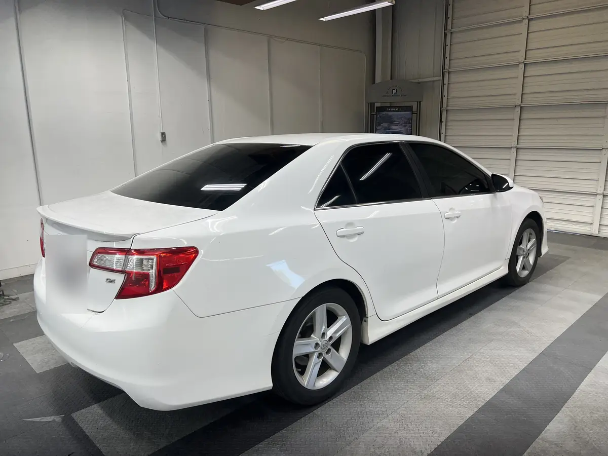 White Toyota Camry after Avery Dennison Encore Supreme ceramic window tint (view 3)