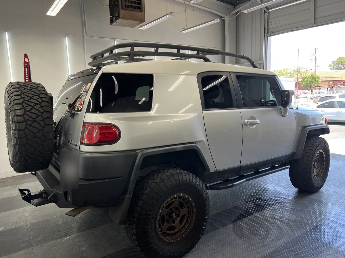 Silver Toyota FJ Cruiser after Avery Dennison Encore Supreme ceramic window tint (view 3)