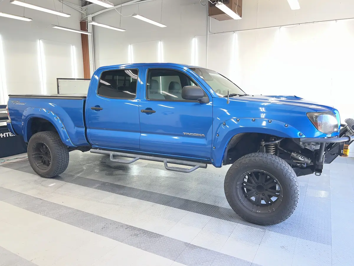 Blue Toyota Tacoma after Avery Dennison Encore Supreme ceramic window tint (view 1)
