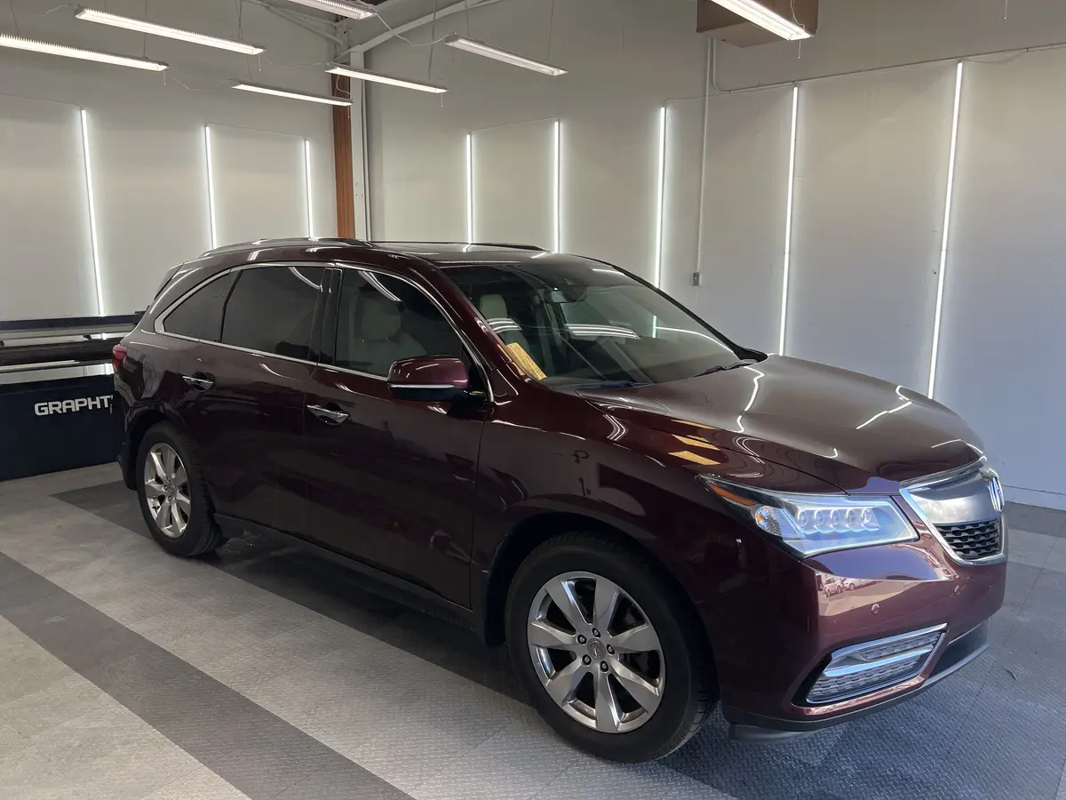 Red Acura MDX after Avery Dennison Encore Supreme ceramic window tint (view 1)