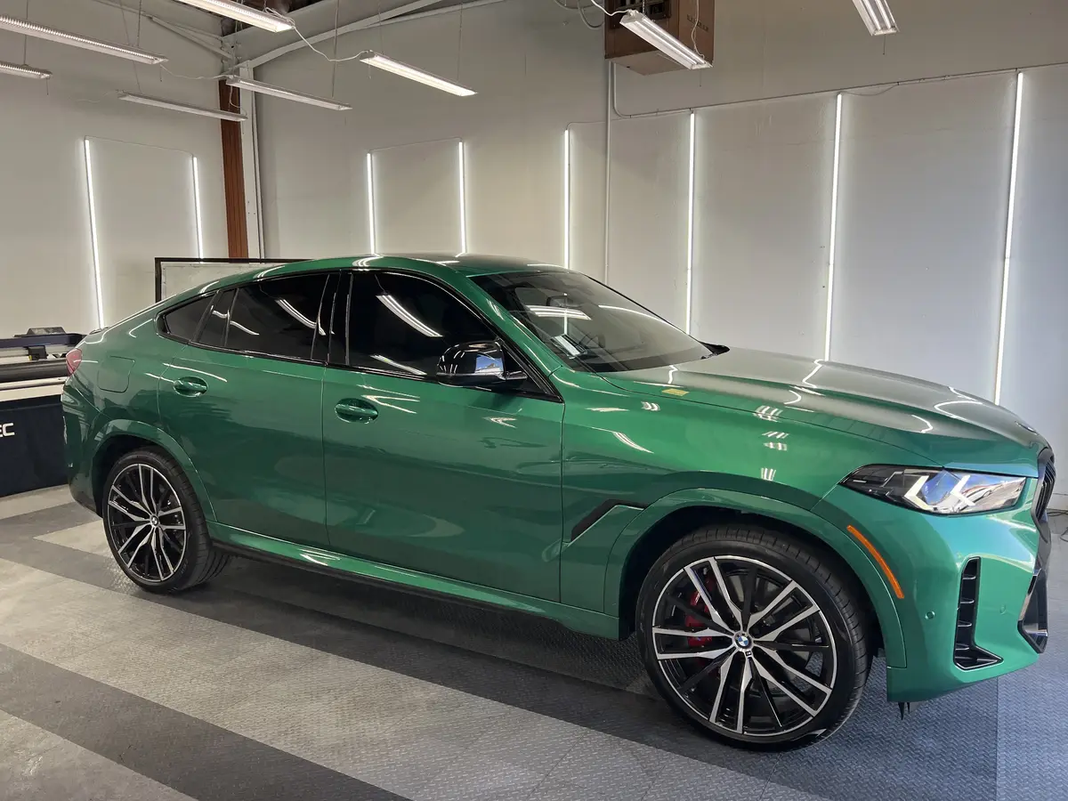 Green BMW X6 after Avery Dennison Encore Supreme IR ir ceramic window tint (view 1)