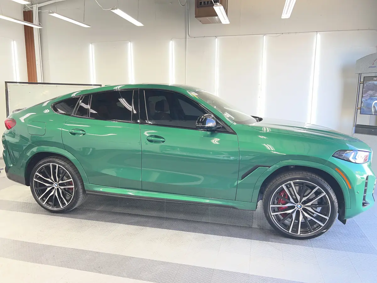 Green BMW X6 after Avery Dennison Encore Supreme IR ir ceramic window tint (view 2)