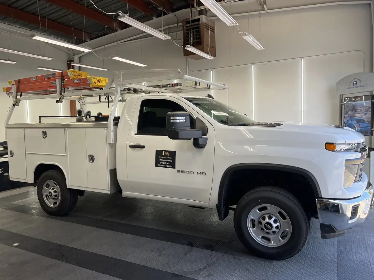 White Chevrolet Silverado 2500HD after Avery Dennison Encore Supreme ceramic window tint (view 1)
