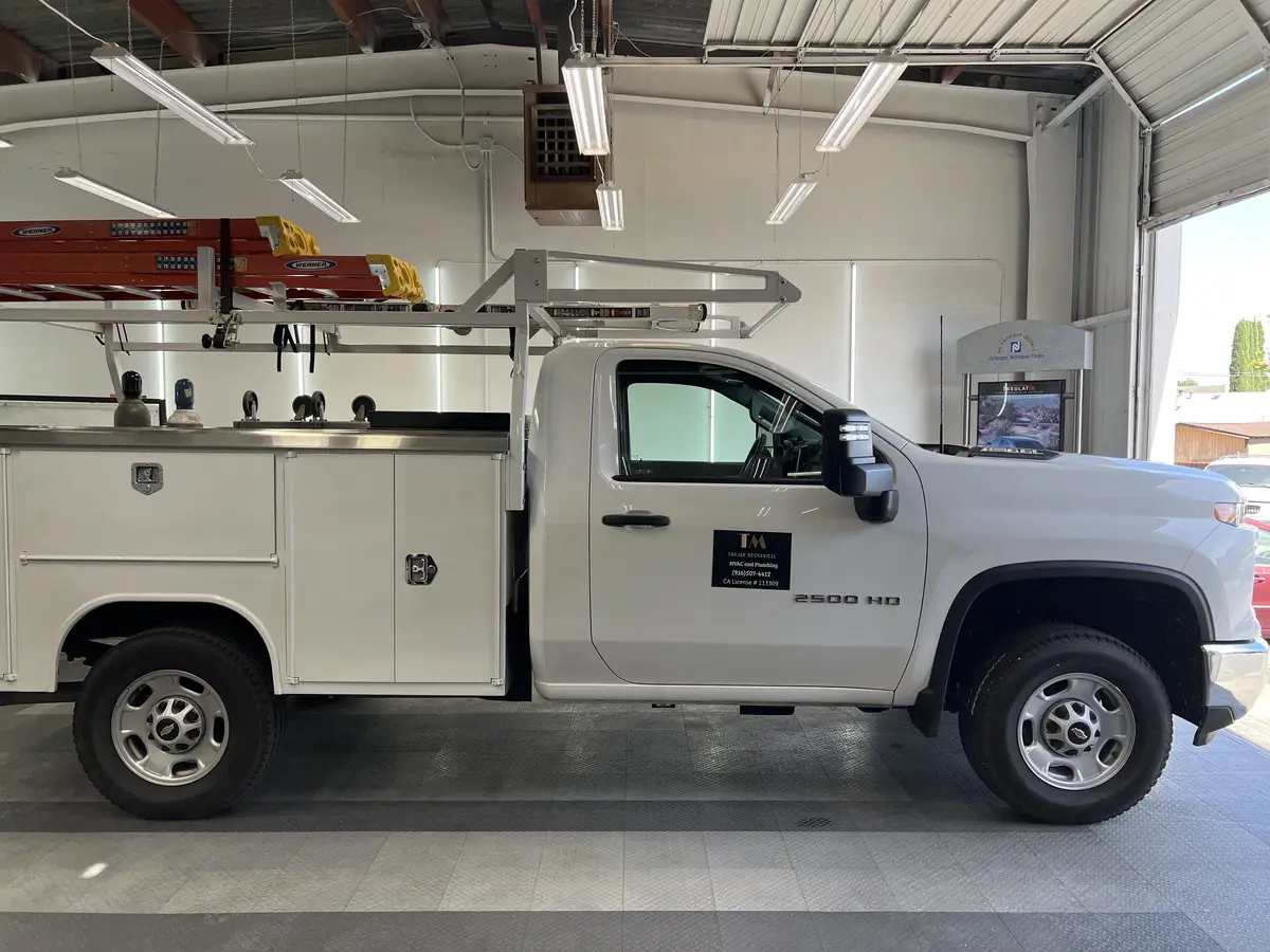 White Chevrolet Silverado 2500HD before window tinting, factory glass (view 1)