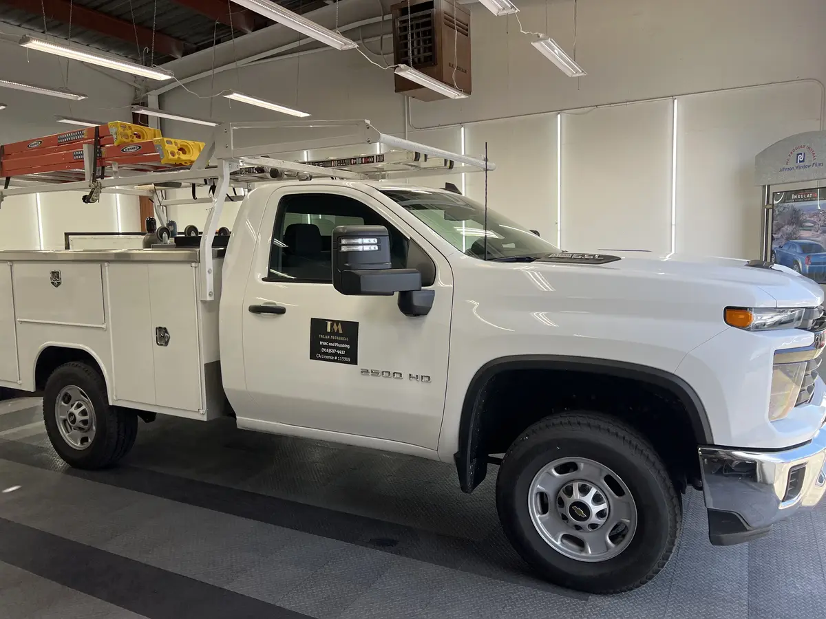 White Chevrolet Silverado 2500HD before window tinting, factory glass (view 2)