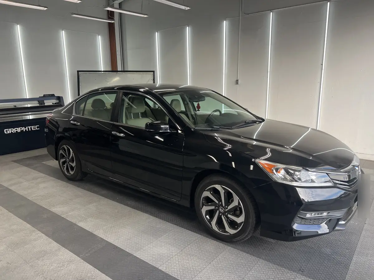 Black Honda Accord before window tinting, factory glass (view 1)