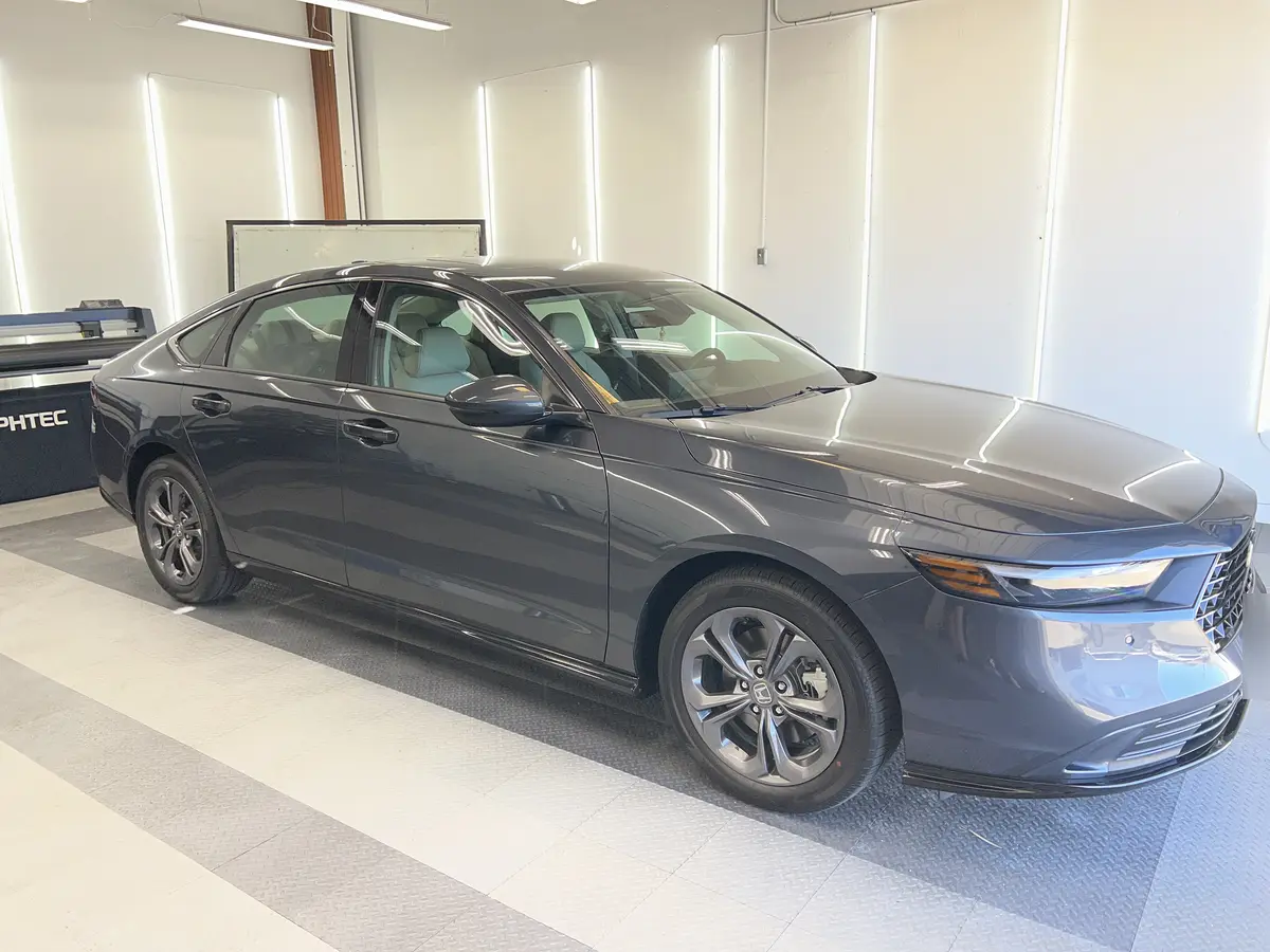 Gray Honda Accord before window tinting, factory glass (view 1)