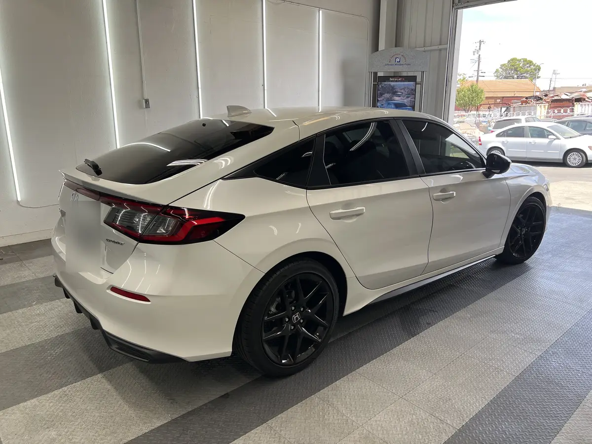 White Honda Civic after Avery Dennison Encore carbon window tint (view 1)