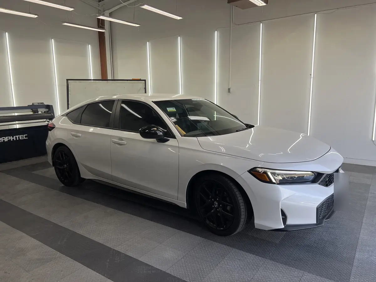 White Honda Civic after Avery Dennison Encore carbon window tint (view 3)