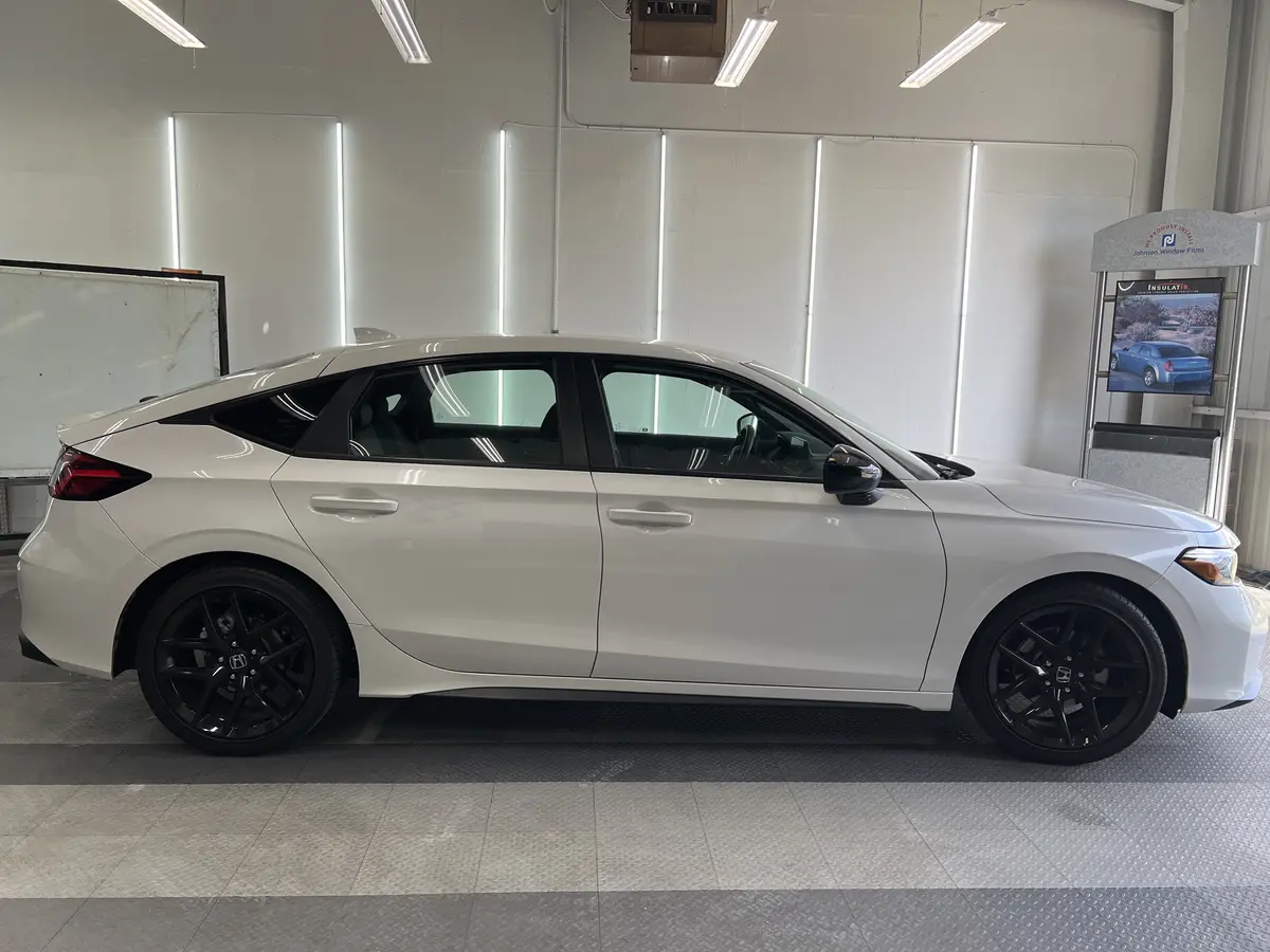 White Honda Civic before window tinting, factory glass (view 2)