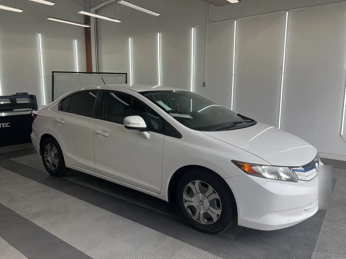 White Honda Civic after Avery Dennison Encore carbon window tint (view 1)