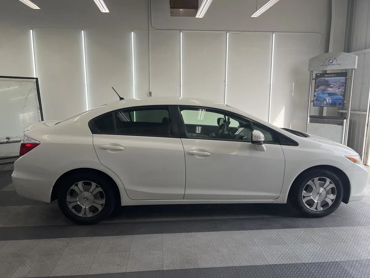 White Honda Civic before window tinting, factory glass (view 2)