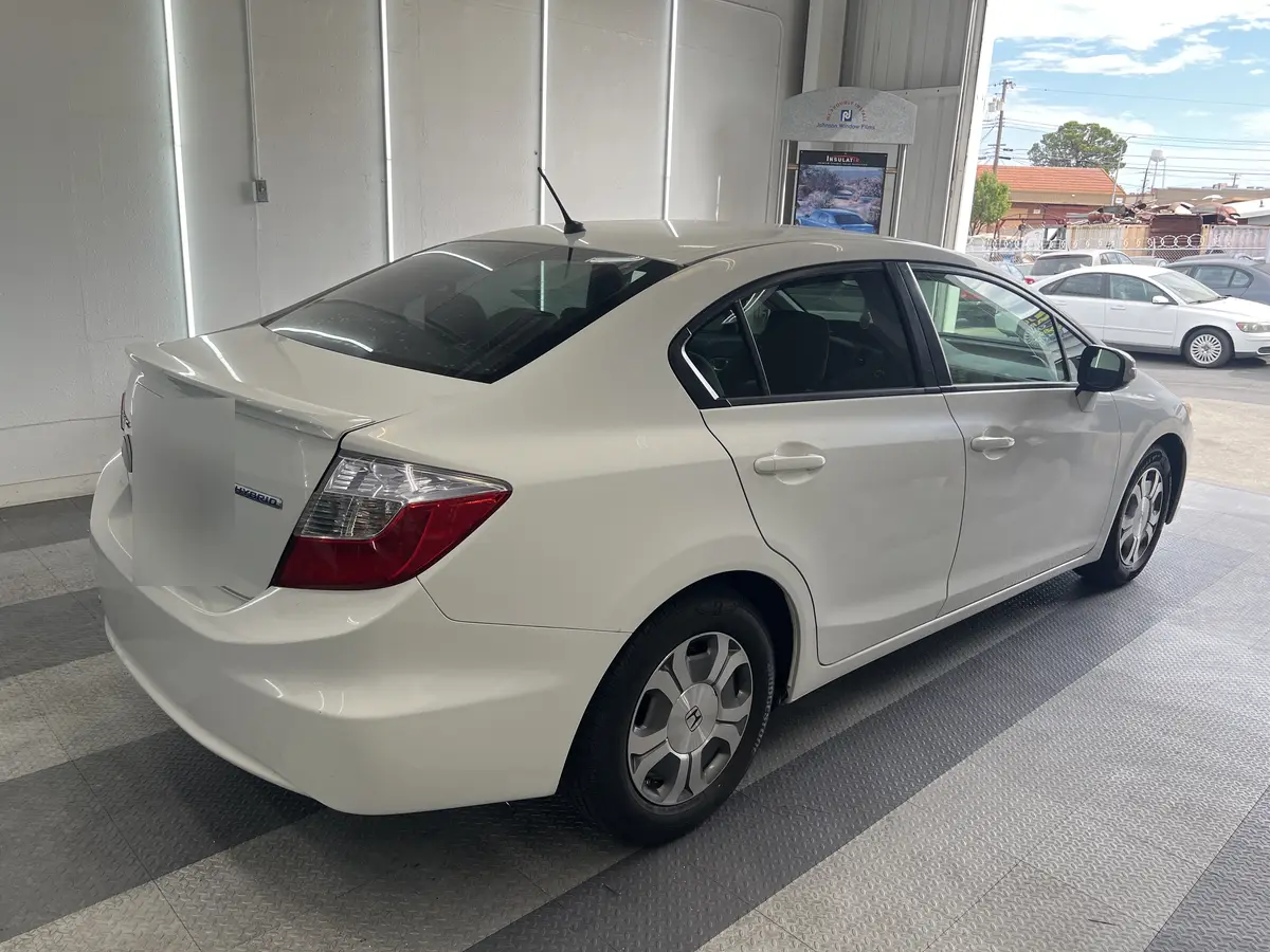 White Honda Civic before window tinting, factory glass (view 3)