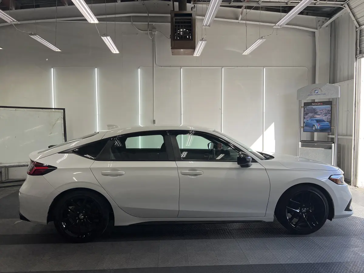 White Honda Civic before window tinting, factory glass (view 2)