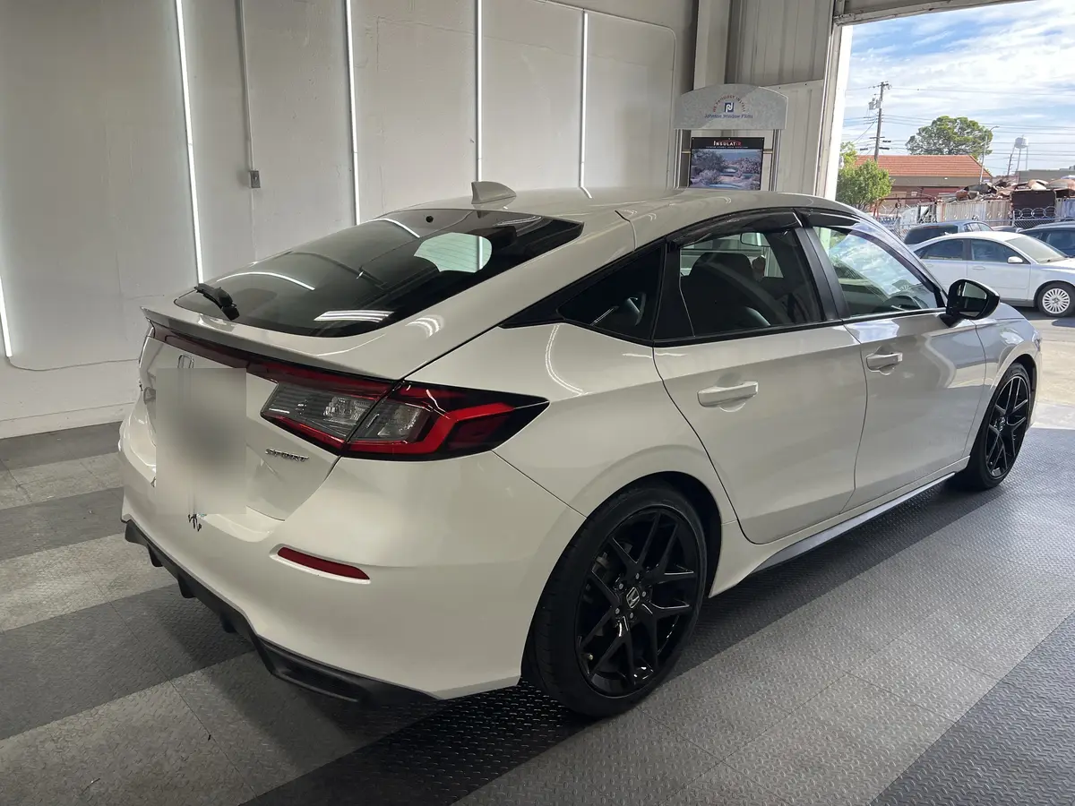 White Honda Civic before window tinting, factory glass (view 3)