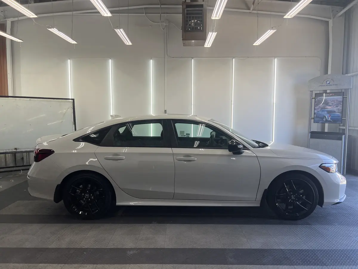 White Honda Civic before window tinting, factory glass (view 2)