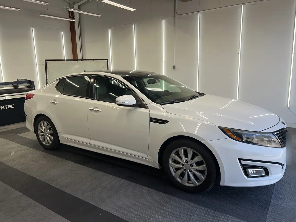 White Kia Optima after Avery Dennison Encore Supreme ceramic window tint (view 1)