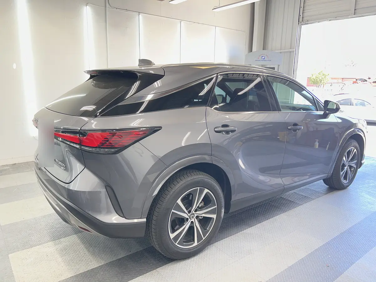 Gray Lexus RX before window tinting, factory glass (view 3)