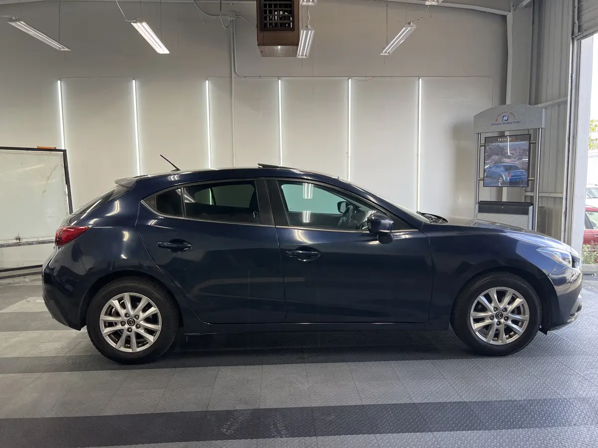 Blue Mazda Mazda3 after Avery Dennison Encore Supreme ceramic window tint (view 2)