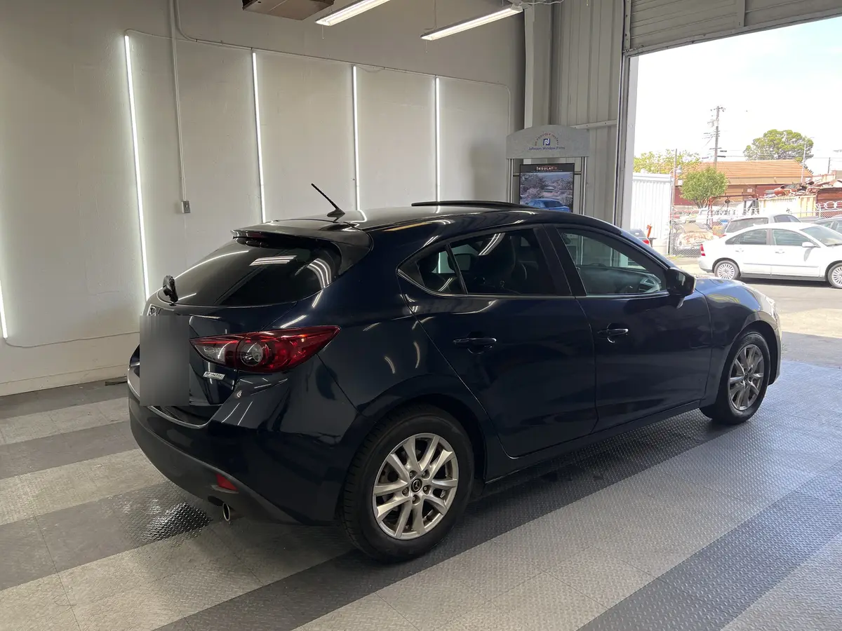 Blue Mazda Mazda3 after Avery Dennison Encore Supreme ceramic window tint (view 3)