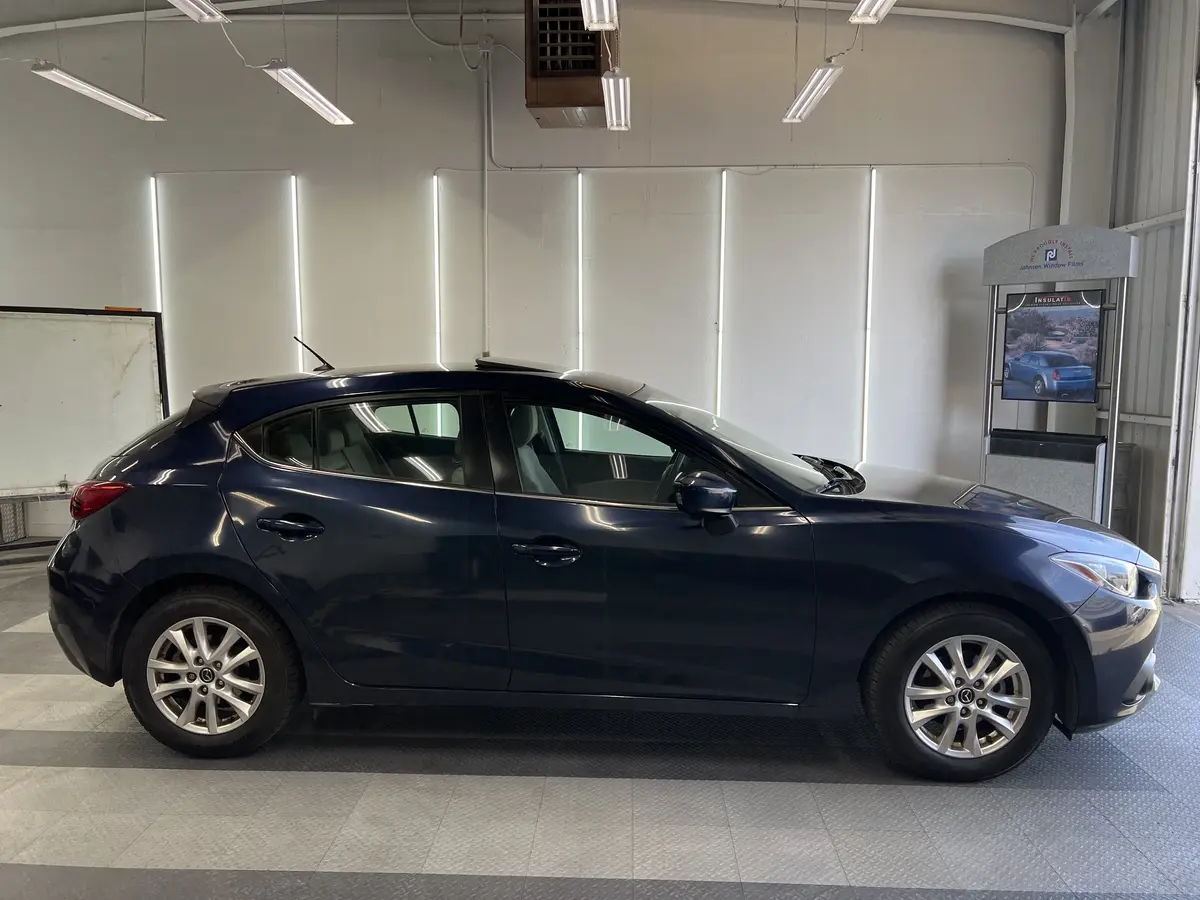 Blue Mazda Mazda3 before window tinting, factory glass (view 2)