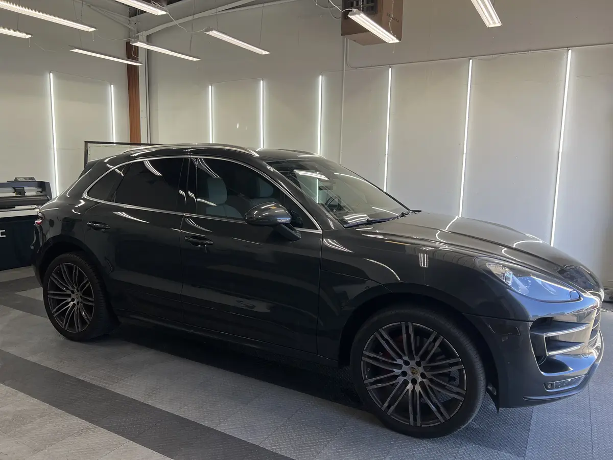 Gray Porsche Macan after Avery Dennison Encore Supreme ceramic window tint (view 1)