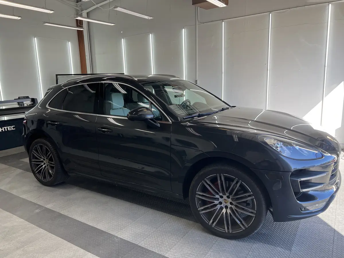 Gray Porsche Macan before window tinting, factory glass (view 2)
