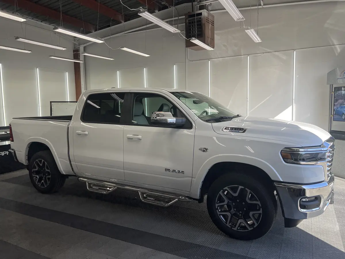 White Ram 1500 before window tinting, factory glass (view 1)