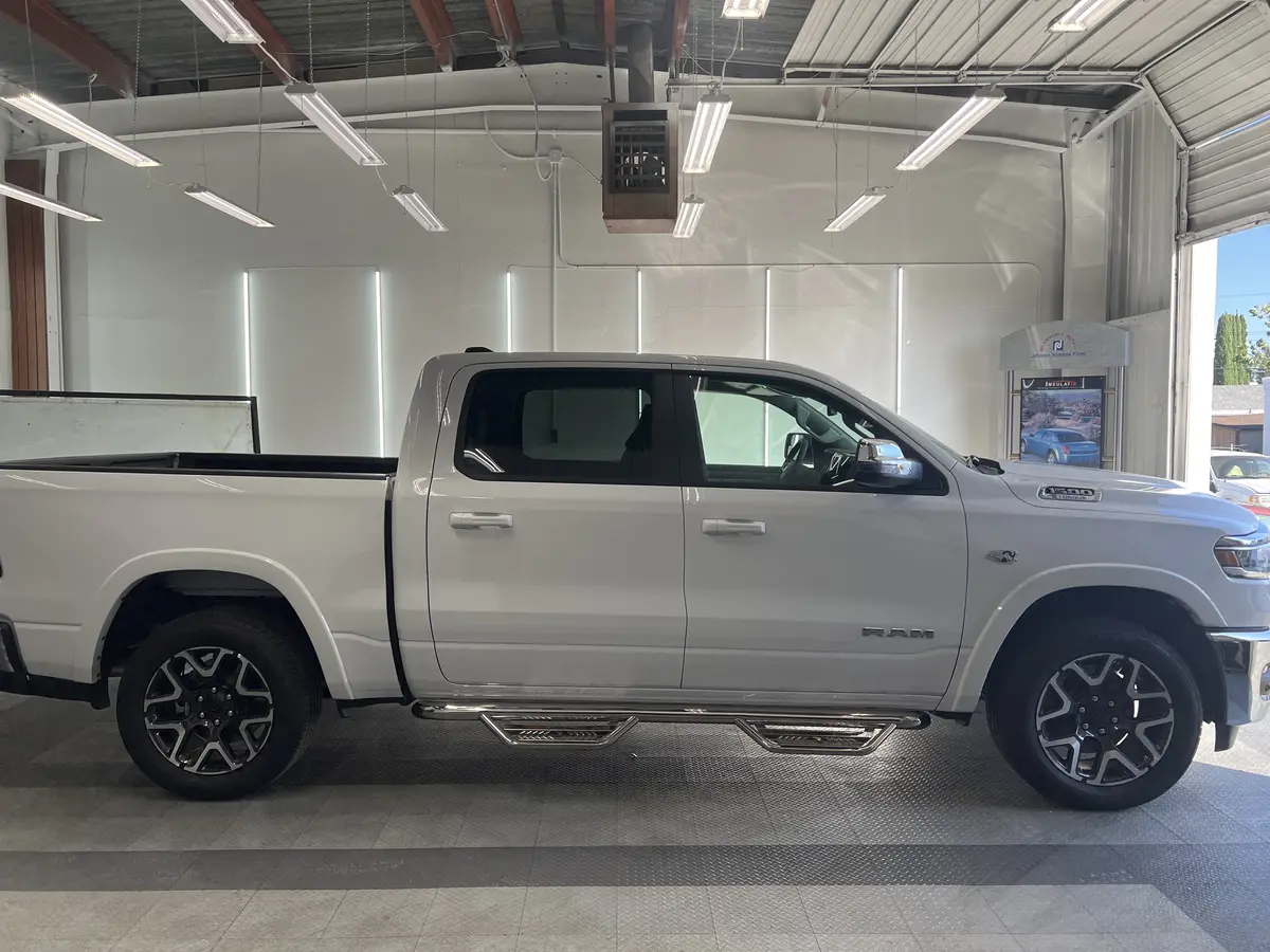 White Ram 1500 before window tinting, factory glass (view 2)