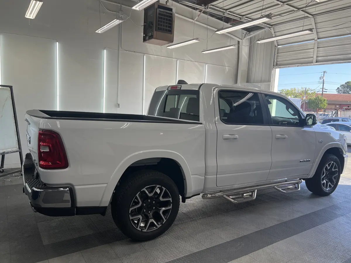 White Ram 1500 before window tinting, factory glass (view 3)