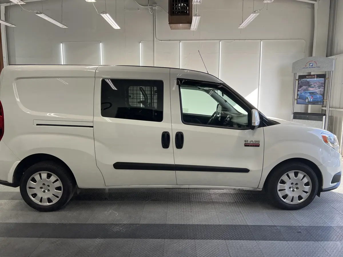 White Ram ProMaster City before window tinting, factory glass (view 2)