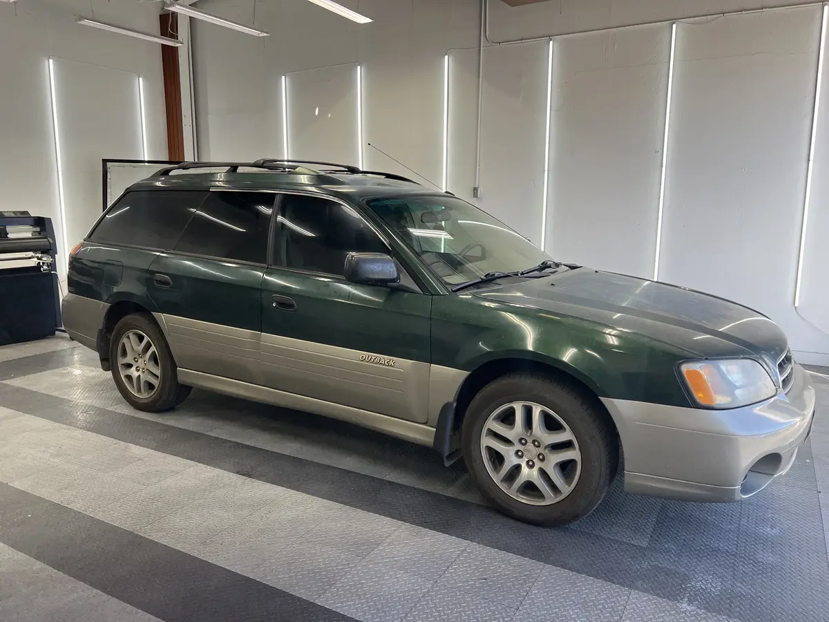 Green Subaru Outback after Avery Dennison Encore Supreme ceramic window tint (view 1)