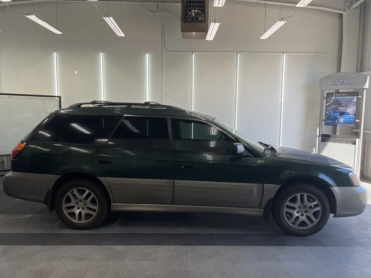 Green Subaru Outback after Avery Dennison Encore Supreme ceramic window tint (view 2)