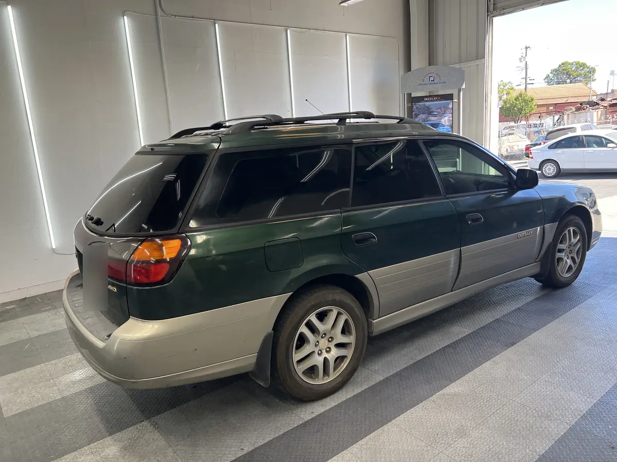 Green Subaru Outback after Avery Dennison Encore Supreme ceramic window tint (view 3)