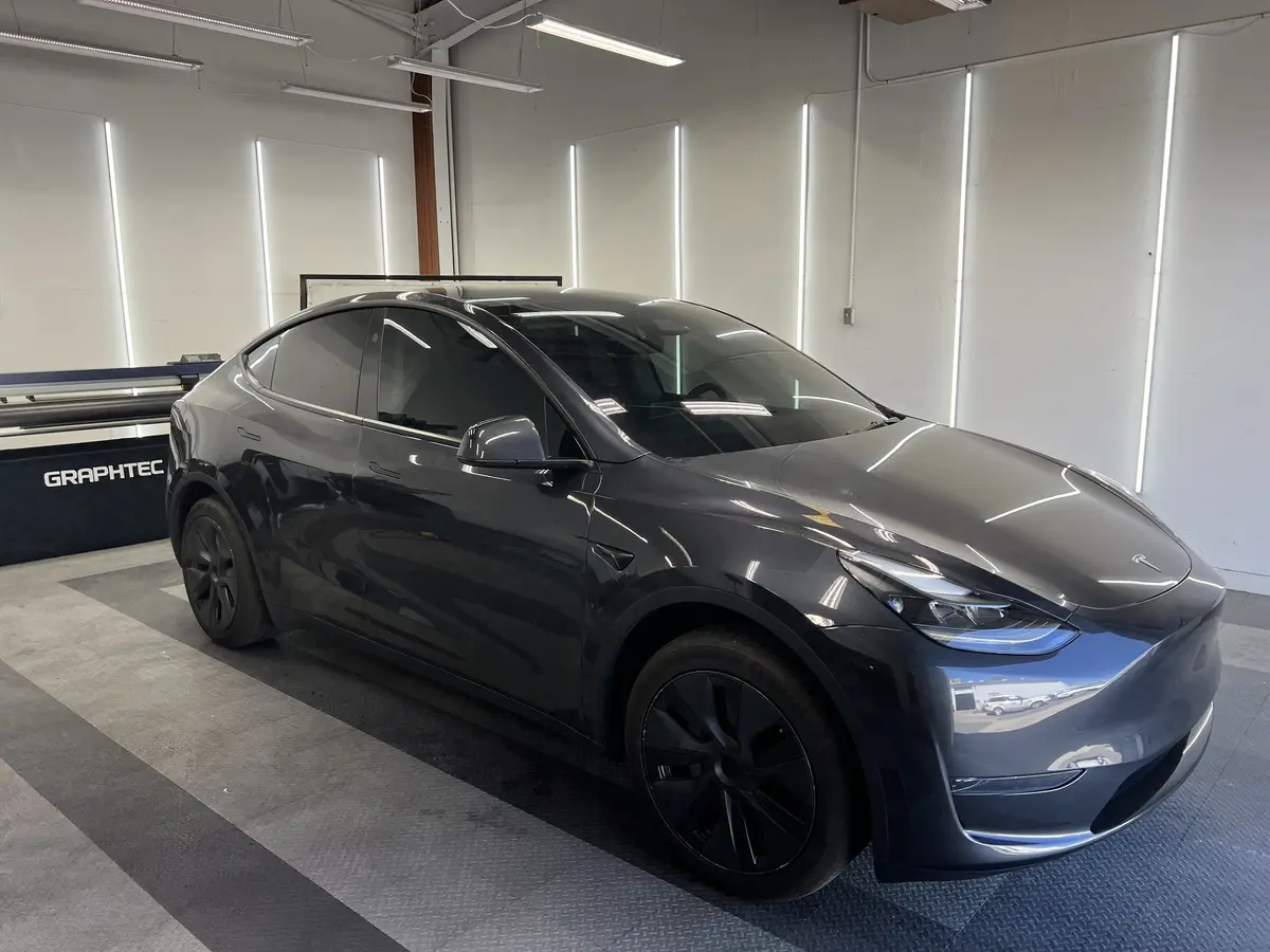Gray Tesla Model Y at Quality Window Tinting, ceramic window tint job (photo 1)