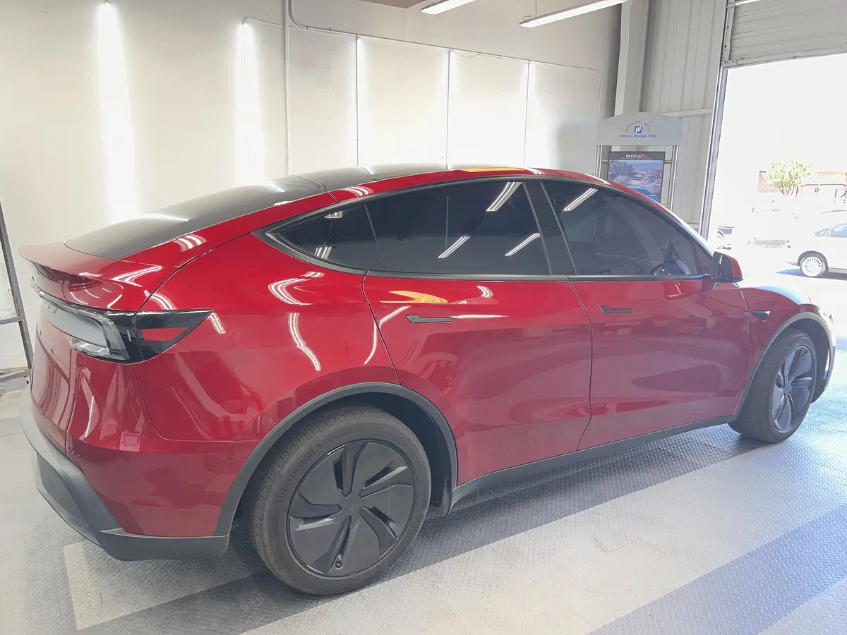 Red Tesla Model Y after Avery Dennison Encore Supreme ceramic window tint (view 3)
