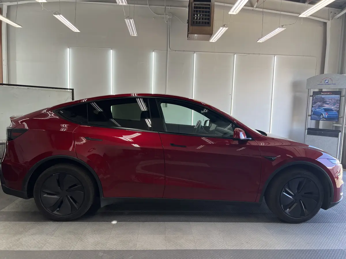 Red Tesla Model Y before window tinting, factory glass (view 2)