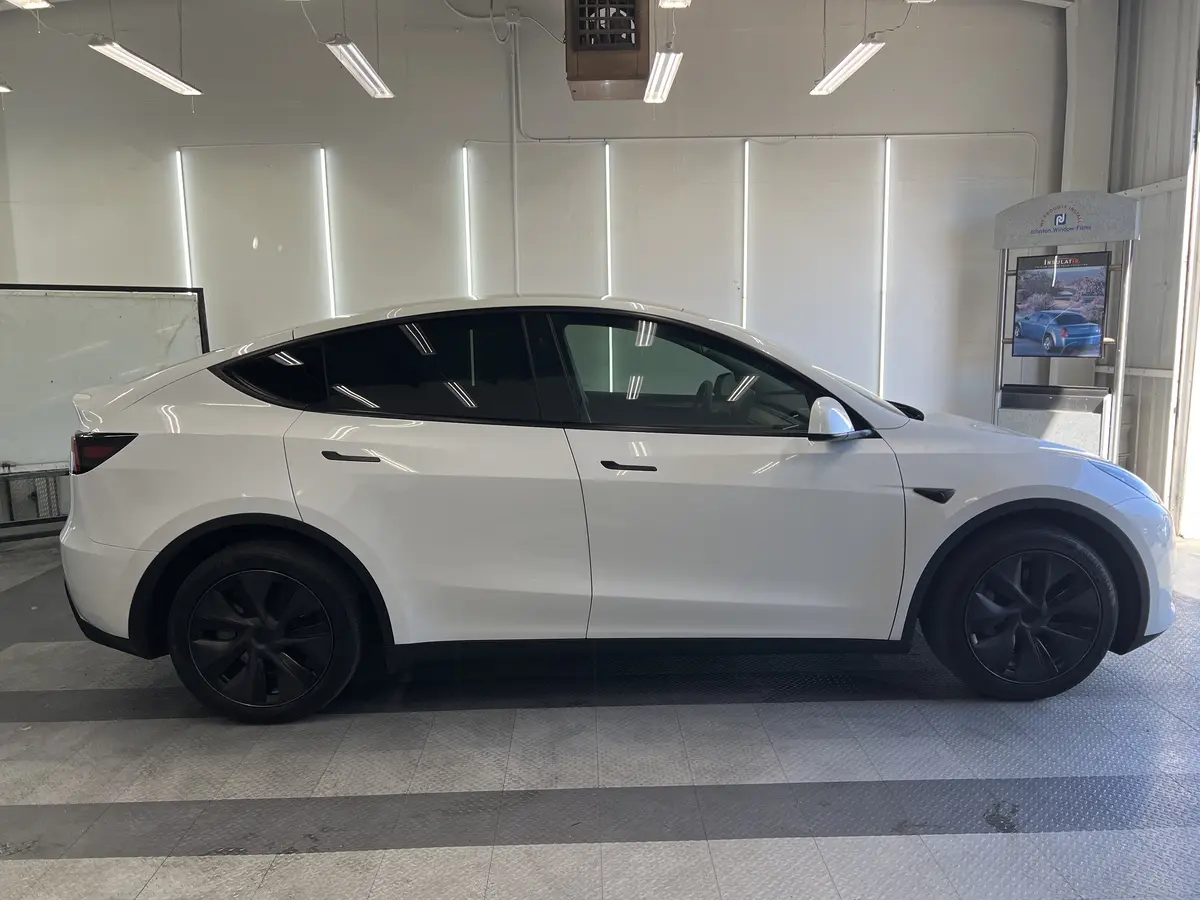 White Tesla Model Y after Avery Dennison Encore Supreme ceramic window tint (view 2)