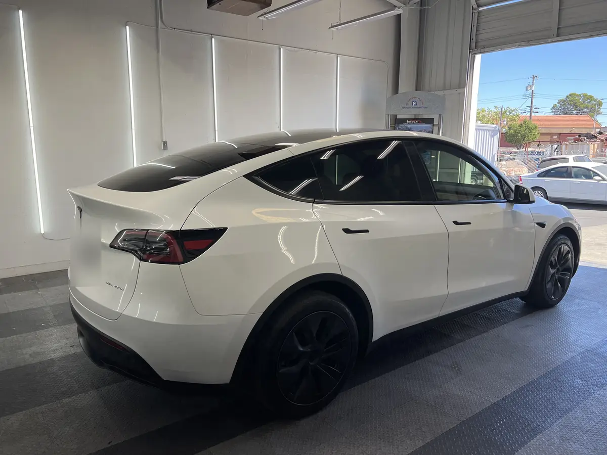 White Tesla Model Y after Avery Dennison Encore Supreme ceramic window tint (view 3)