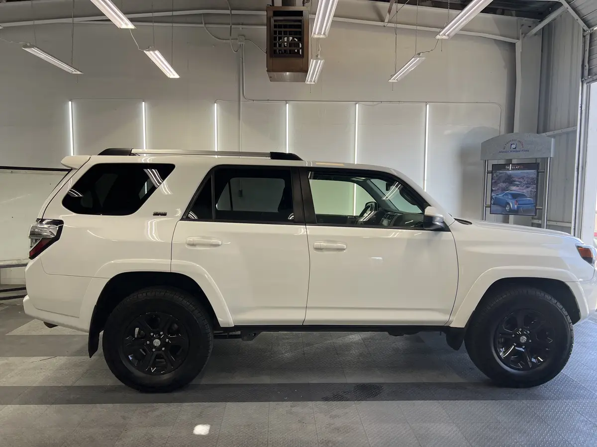 White Toyota 4Runner before window tinting, factory glass (view 1)