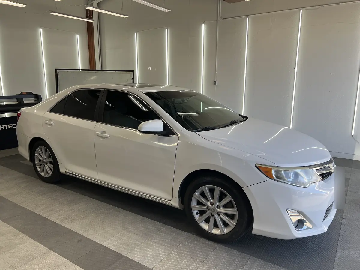 White Toyota Camry after Avery Dennison Encore carbon window tint (view 1)
