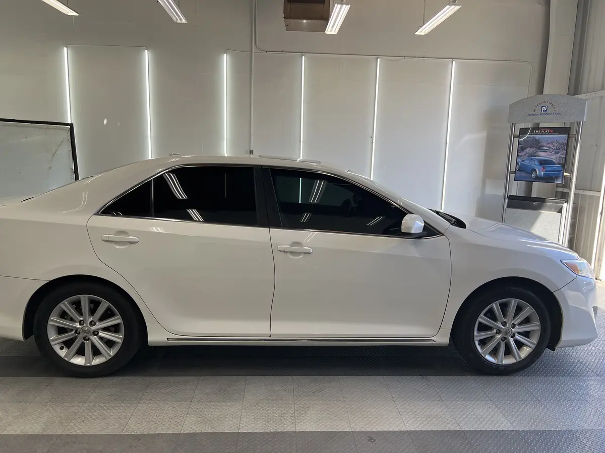 White Toyota Camry after Avery Dennison Encore carbon window tint (view 2)