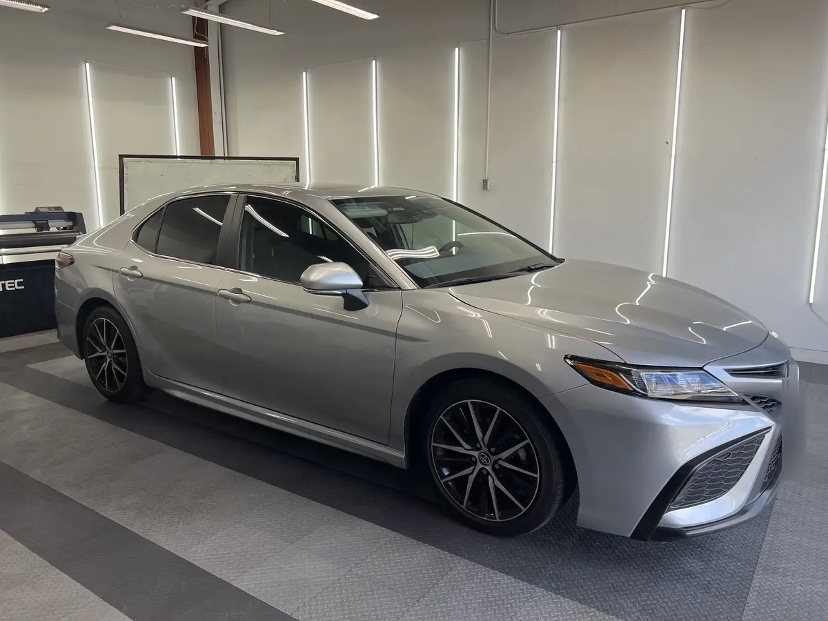 Silver Toyota Camry after Avery Dennison Encore carbon window tint (view 1)