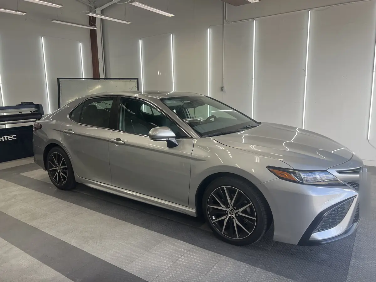 Silver Toyota Camry before window tinting, factory glass (view 1)