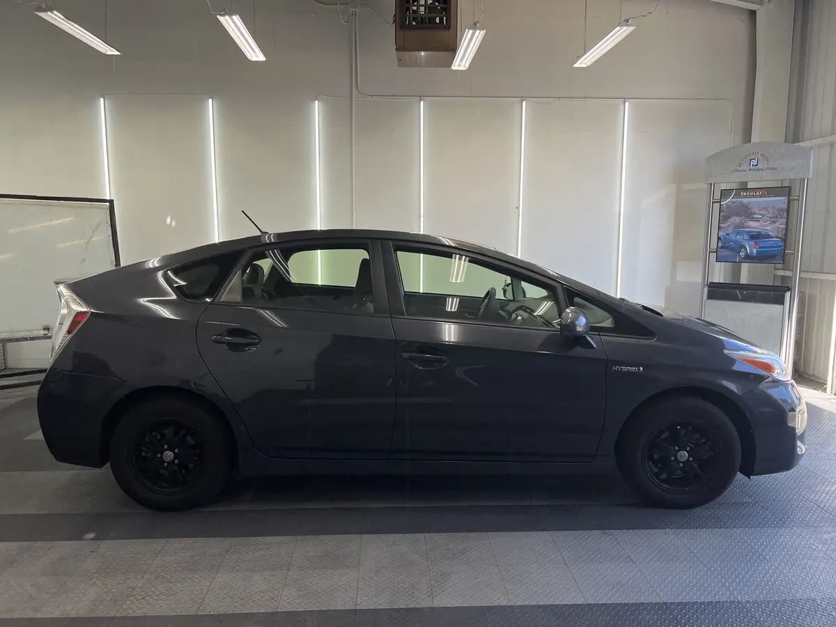 Gray Toyota Prius before window tinting, factory glass (view 2)