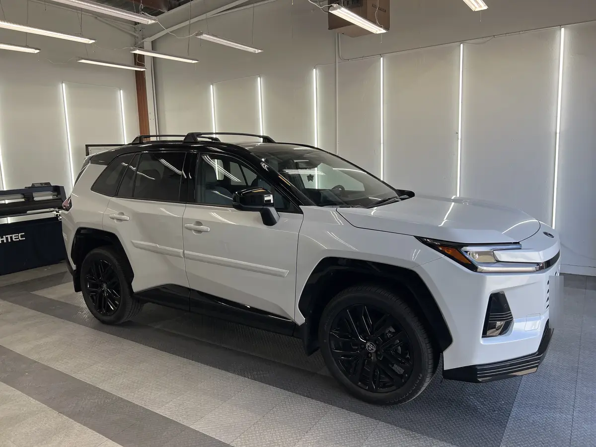 White Toyota RAV4 before window tinting, factory glass (view 1)