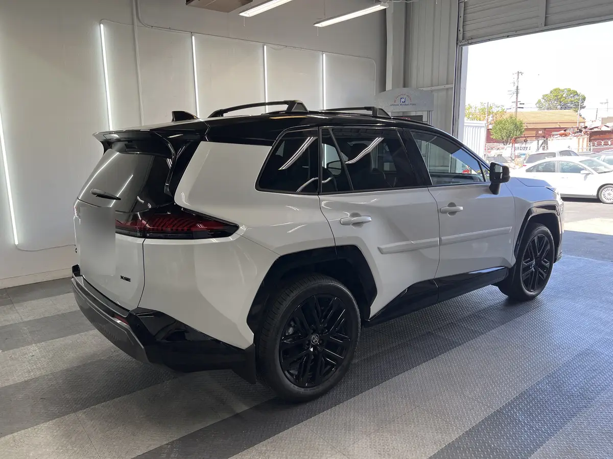 White Toyota RAV4 before window tinting, factory glass (view 2)